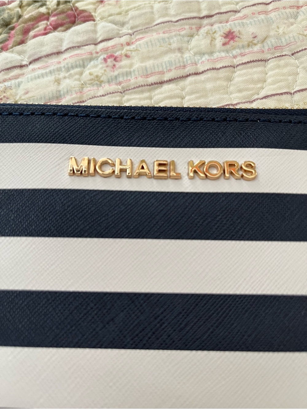Michael Kors Navy and White Striped Women’s small clutch.